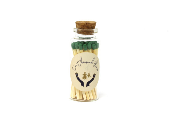 Green tipped matchsticks in a little bottle with a cork top.
