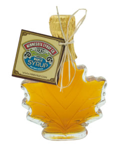 Jar of maple syrup in the shape of a maple leaf.