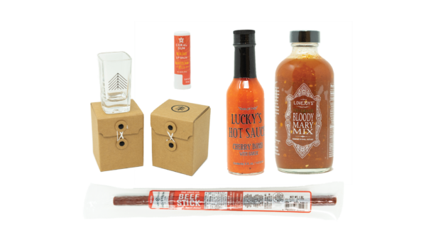 Beef Sticks, Cherry Bomb Hot Sauce, Tree-Shot Shot Glasses, Bloody Mary Mix, Mineral Lip Balm on white background.